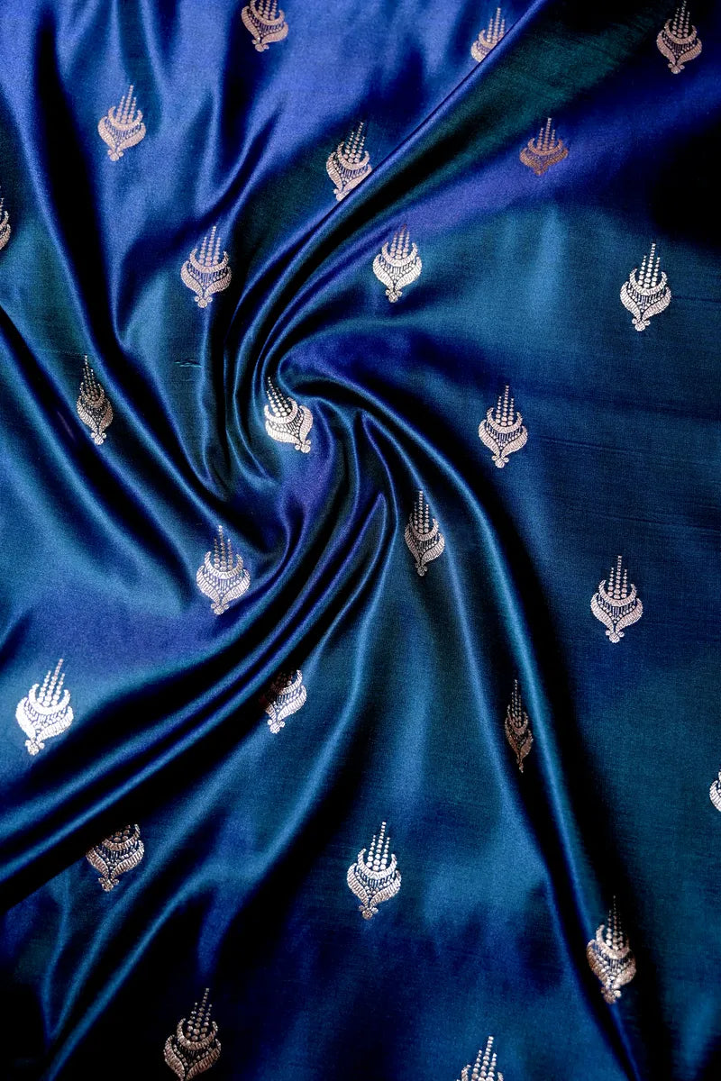 Peacock Blue Banarasi Katan Silk Saree with Silver Zari Butis & Floral Border (RLSS-269)