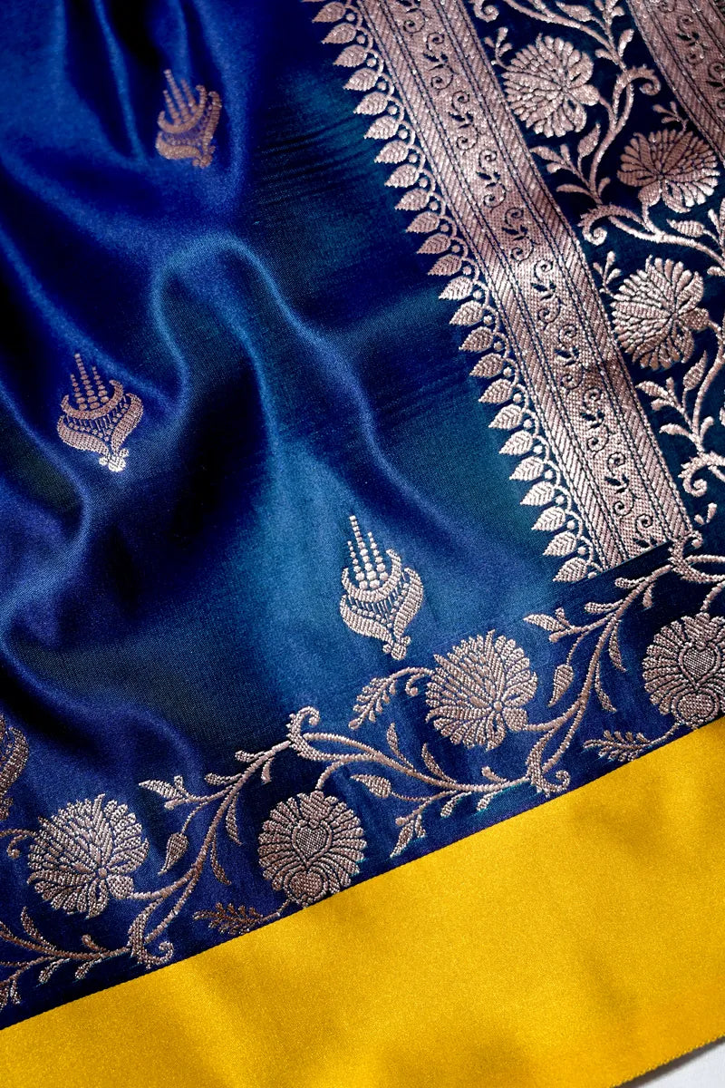 Peacock Blue Banarasi Katan Silk Saree with Silver Zari Butis & Floral Border (RLSS-269)