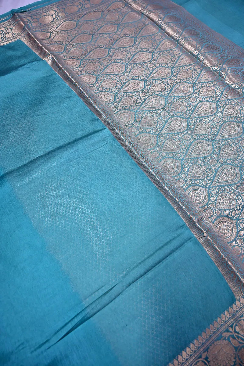 Vibrant Teal Silk Saree featuring Classic Woven Zari Border & Textured Body(RLSS-210)
