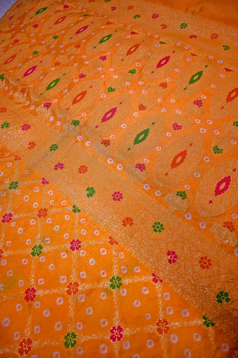 Mustard Orange Bandhani Silk Saree with Gold Zari Jaal & Colorful Meenakari Floral Border(RLSS-169)